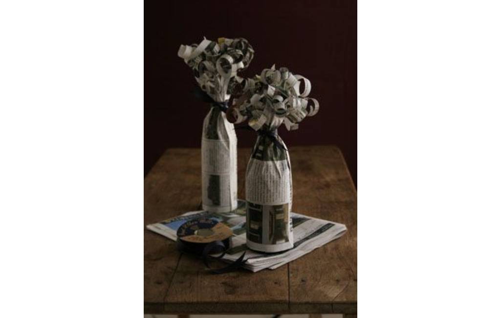 Give a bottle wrapped in newspaper as a gift